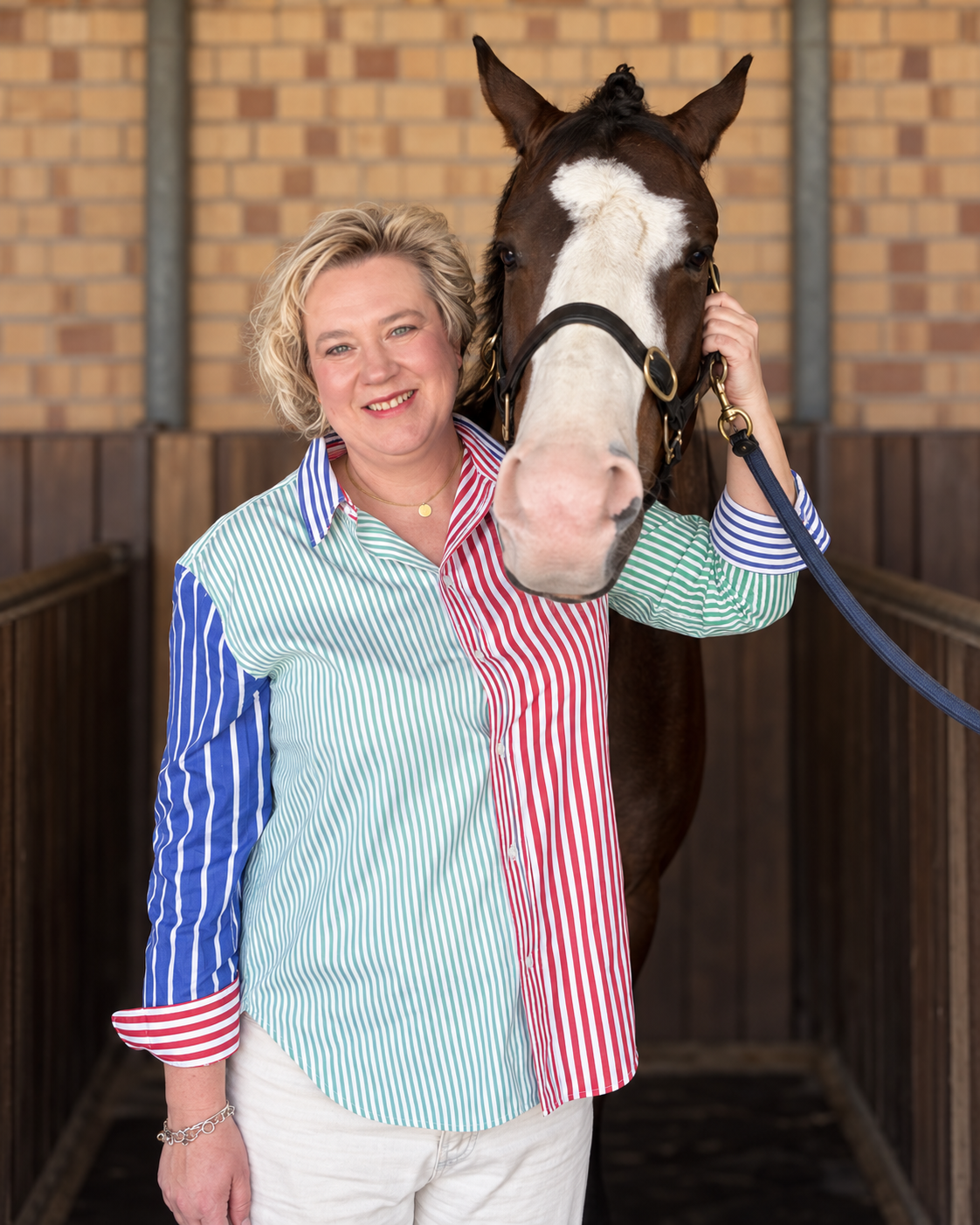 Nadia Horne with a horse at the stables